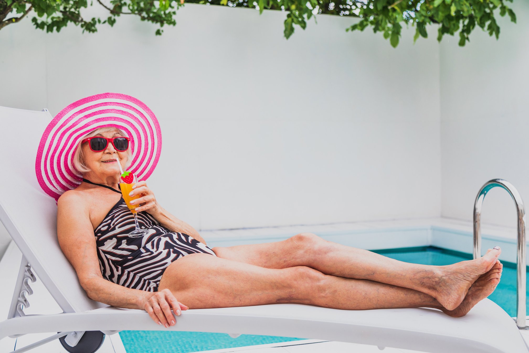 Happy Senior Woman at the Swimming Pool